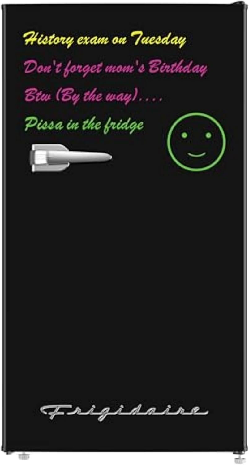 Black Frigidaire mini fridge with a dry-erase front featuring handwritten reminders and a smiley face, ideal for dorms.