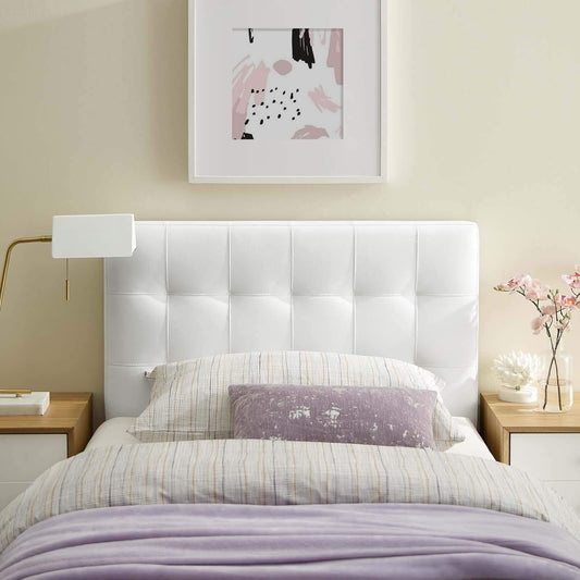 Twin XL Bed with white tufted headboard in dorm room setting. 