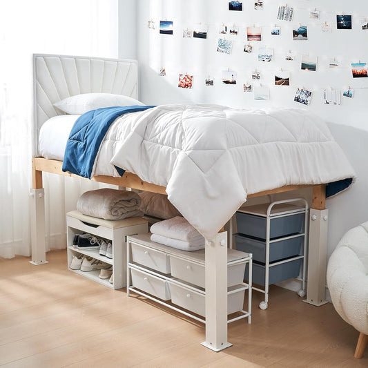 Twin XL dorm bed raised on white metal risers with storage bins and drawers underneath.