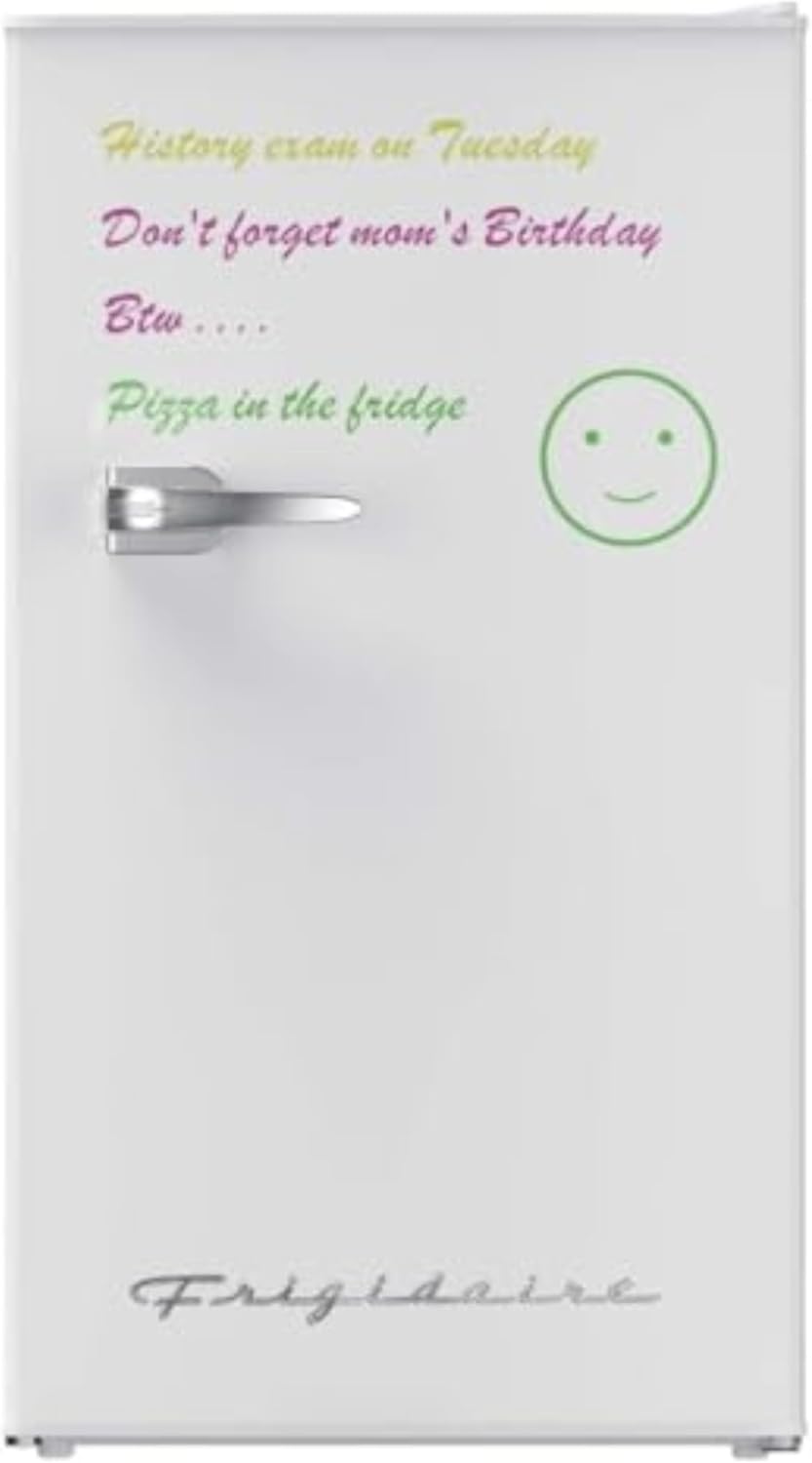 White Frigidaire mini fridge with a dry-erase front featuring handwritten reminders and a smiley face, ideal for dorms.