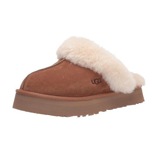 Brown Ugg slipper with white fur lining perfect for dorm or even for class